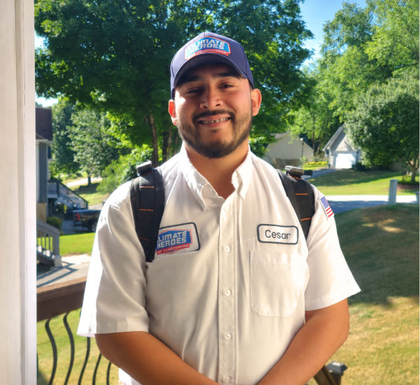 Climate Heroes service technician greeting a customer at the door